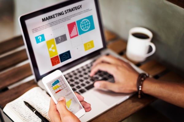Inbound marketing strategy for banks and credit unions on laptop and phone.
