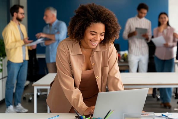 Woman looking at new bank and credit union website design.