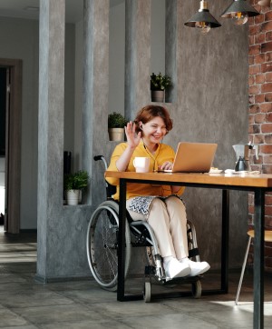 Woman in wheelchair talking on video chat