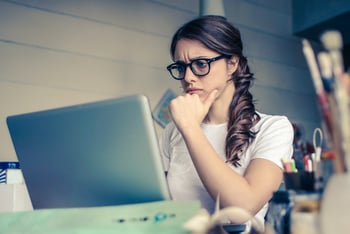 Woman on Laptop Thinking