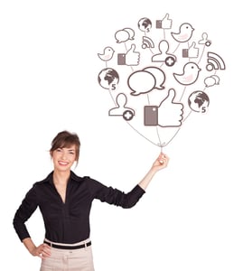 Happy young lady holding social icon balloon