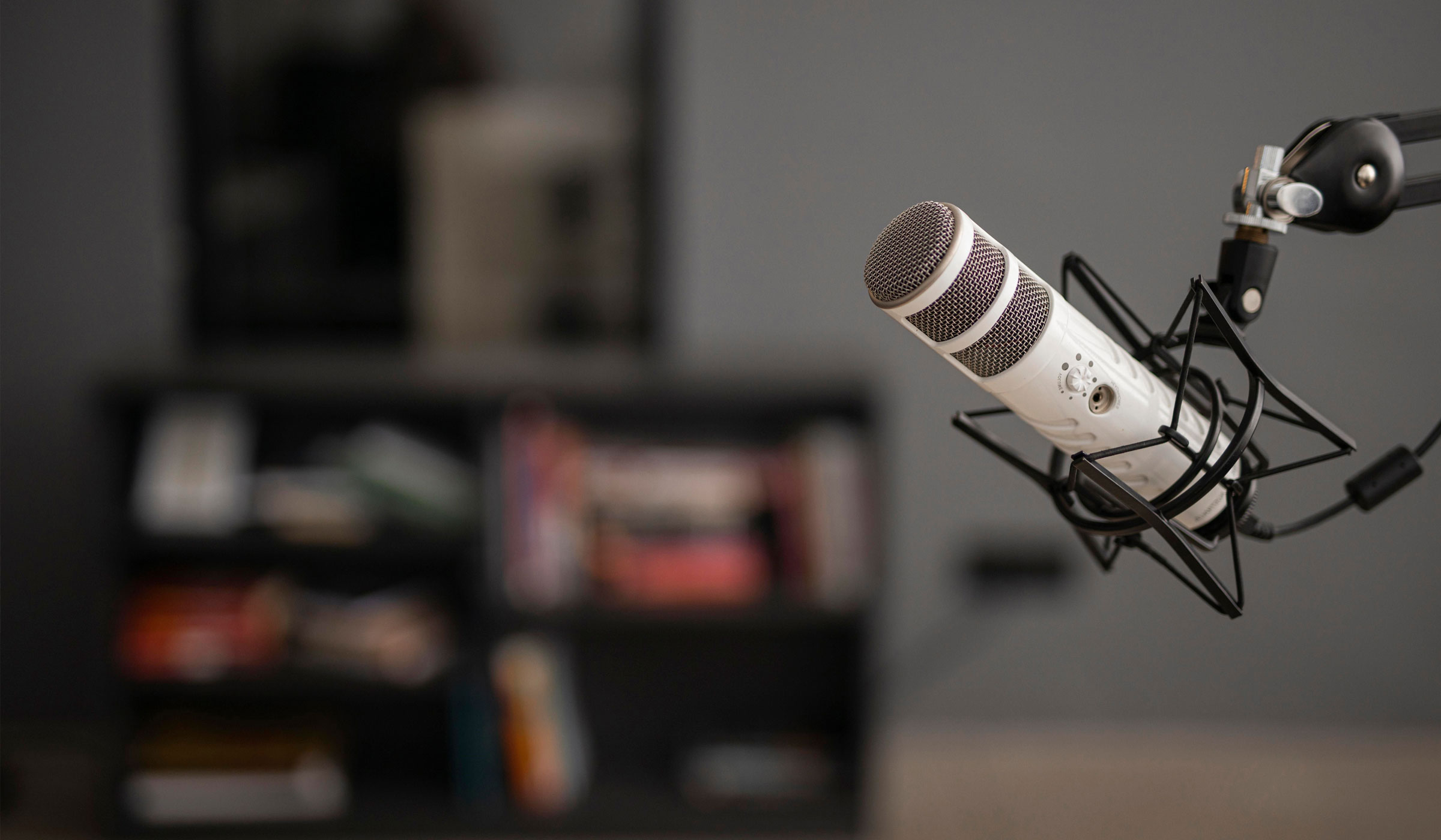 Podcast microphone with blurred background.